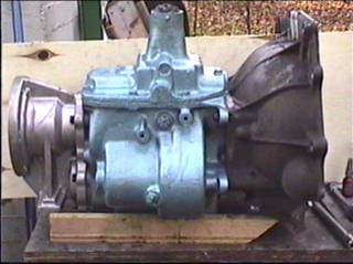 Transfer case adapter, transmission, bell housing